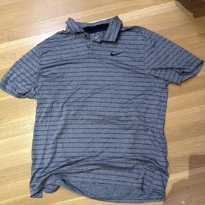 Nike Dri Fit golf shirt. Navy blue striped shirt